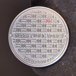 Derry Public Works Sewer Lid Pin — “IT” Hidden Detail